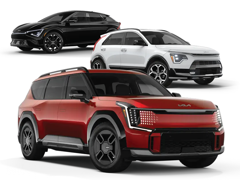 Three Kia electric SUVs are shown: a red 2026 Kia EV9 in the foreground, a white 2025 Kia Niro EV, and a black 2025 Kia EV6 behind it. All vehicles are angled slightly to the right on a white background.