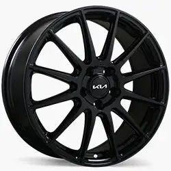 Glossy black Kia alloy wheel featuring a 10-spoke design and Kia logo at the centre.
