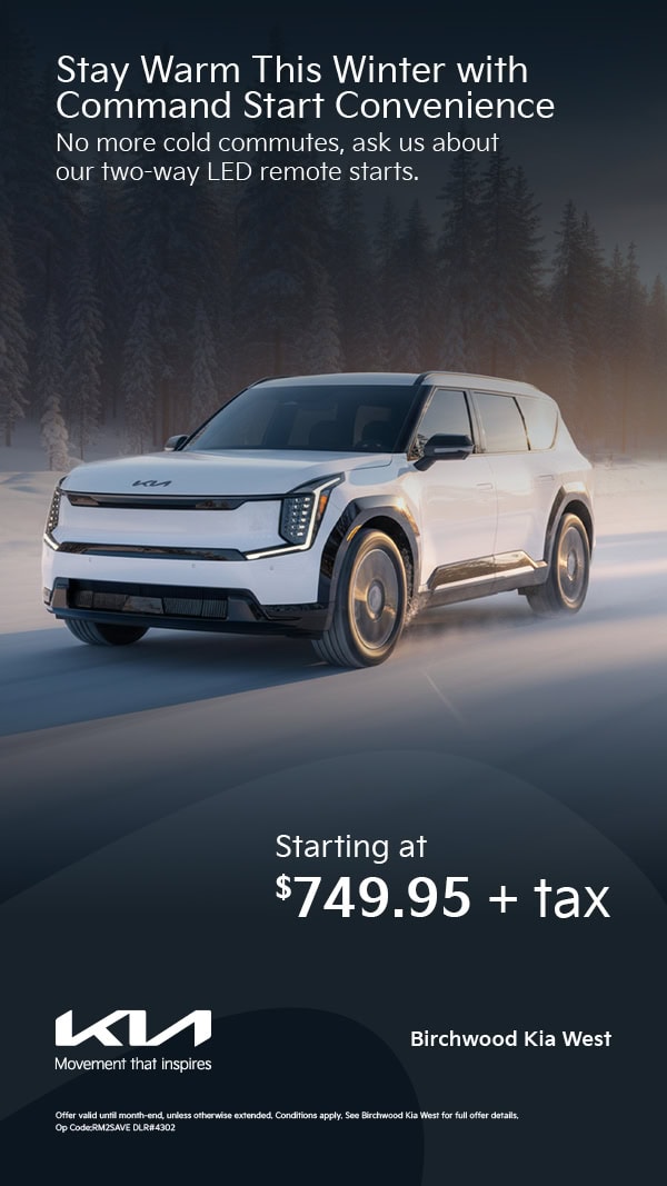 A winter service ad showing a white Kia SUV driving through snow, promoting factory-approved command start options starting at seven hundred forty nine dollars and ninety five cents plus tax for Birchwood Kia West.