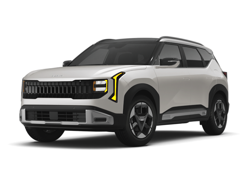 White Kia SUV with modern, angular design, black accents, and distinctive vertical LED headlights shown in front-side view.