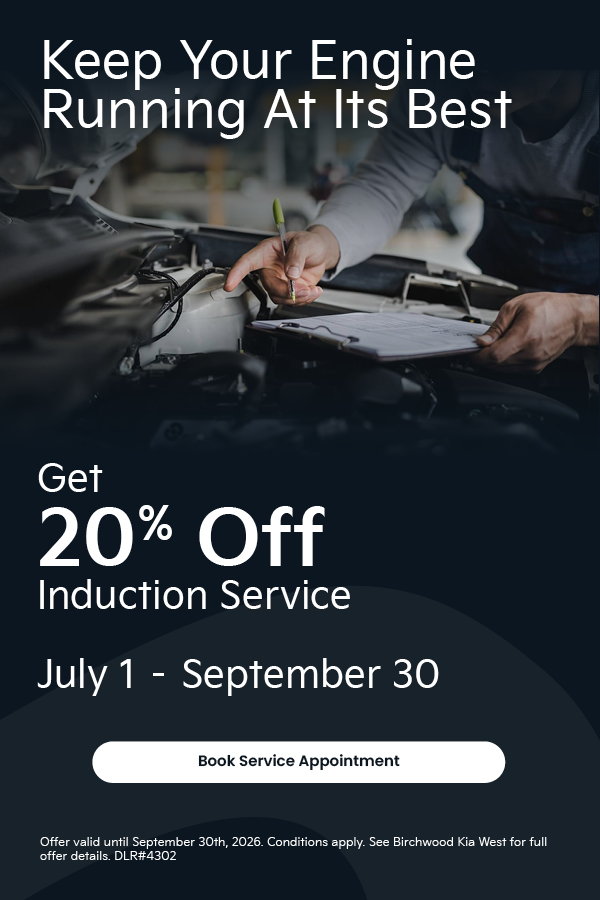 Mechanic inspecting engine with clipboard; promotion offers 20% off induction service from July 1 to September 30, 2026.